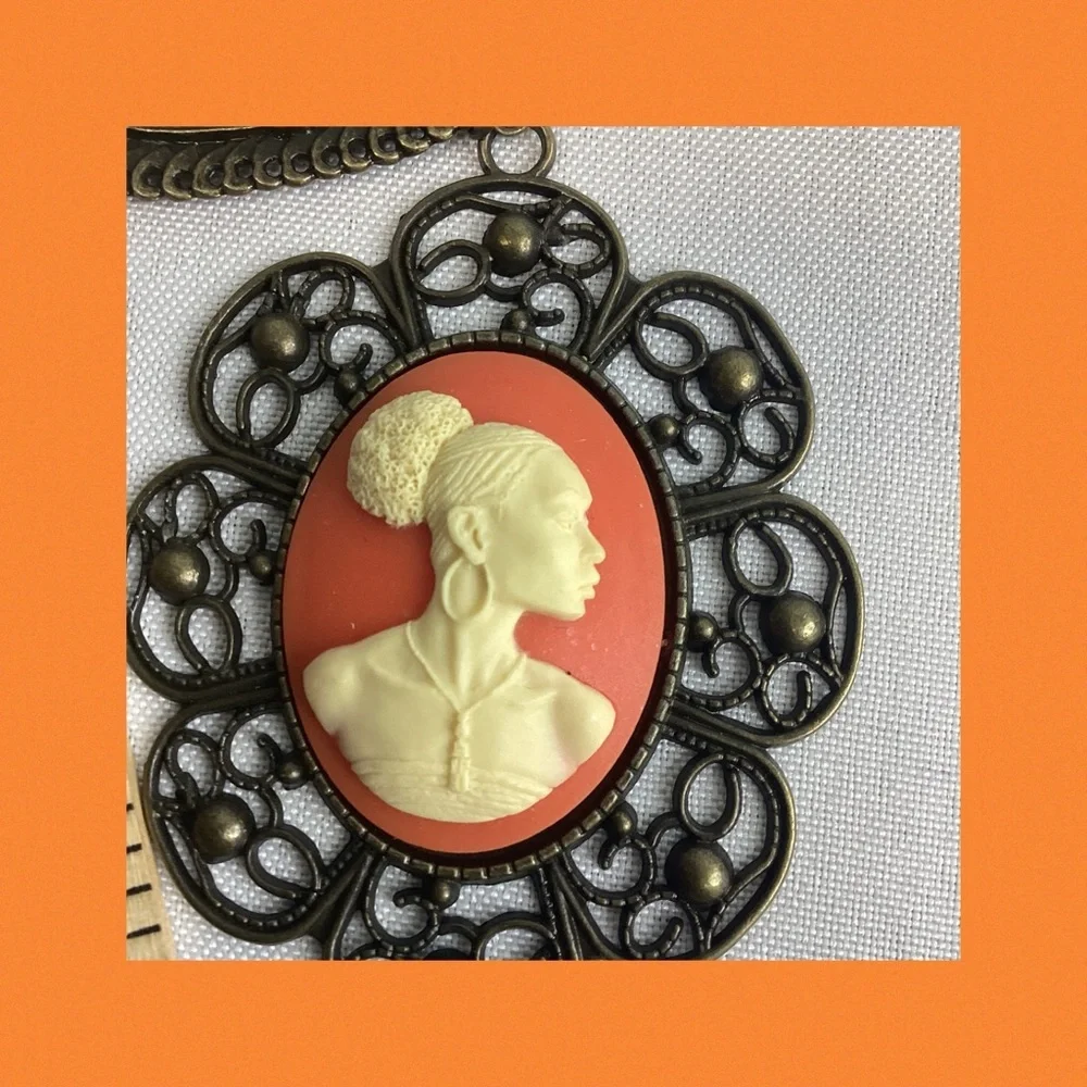 Orange and bronze cameo necklace.